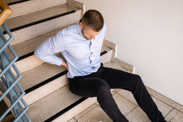 man fallen down a stairwell injured