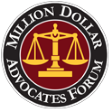 A circular badge with a dark background and red center features a gold balance scale in the middle. The text around the outer edge reads 