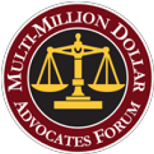 A circular emblem with a maroon border and a black center. The border reads 