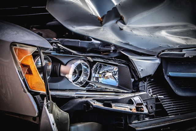 damaged front headlight of vehicle