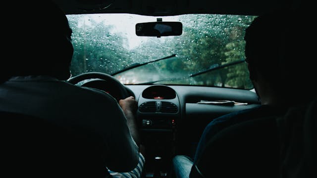 two men in a car