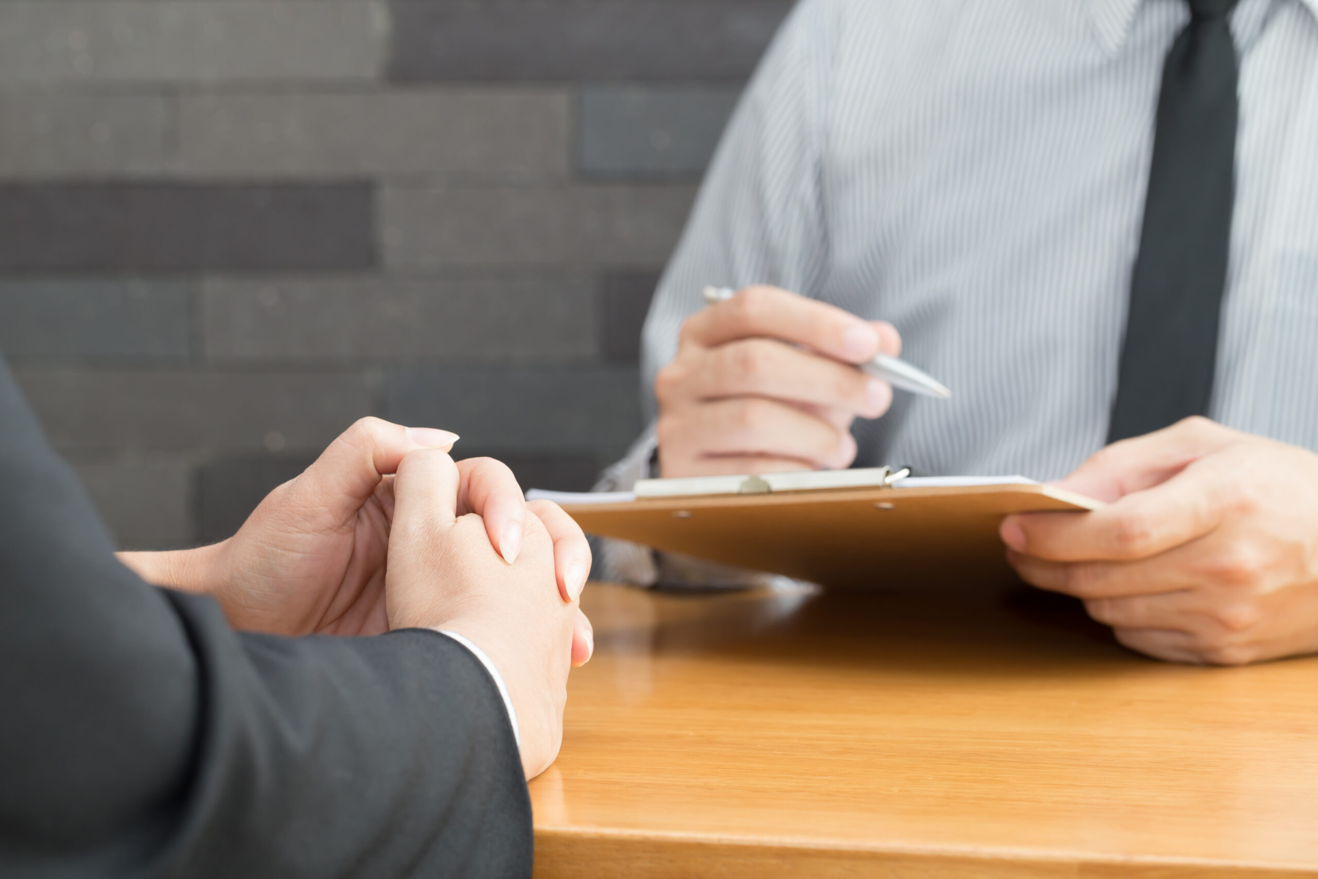 consultation with personal injury attorney man with clipboard taking notes
